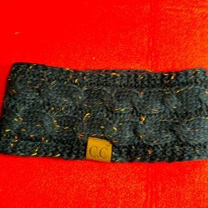 C.C. Knit ear warmer. Dark Blue w/ orange specks throughout! Fuzzy on underside.